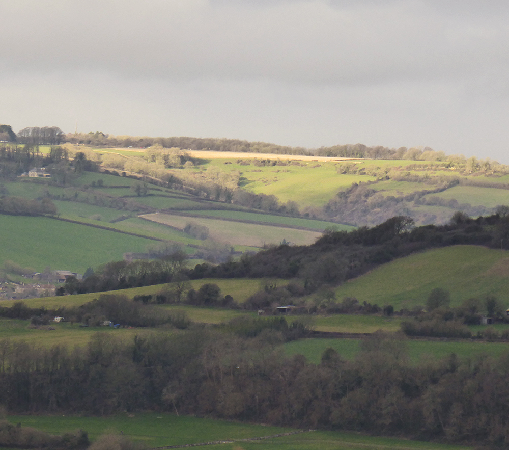 Sunshine breaking through over the hills